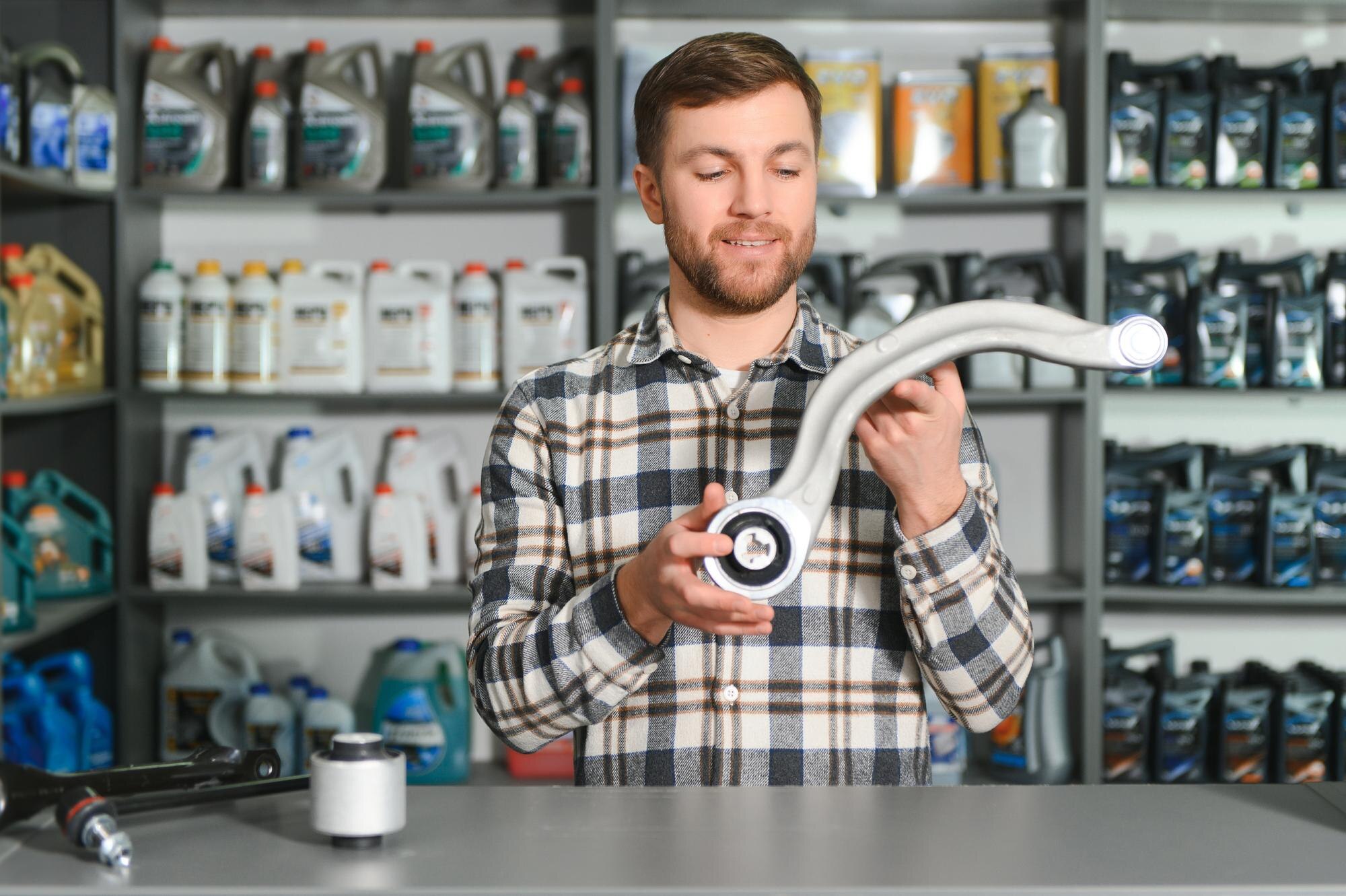 auto-parts-store-seller-receives-product-evaluates-quality-255667-71775.jpg
